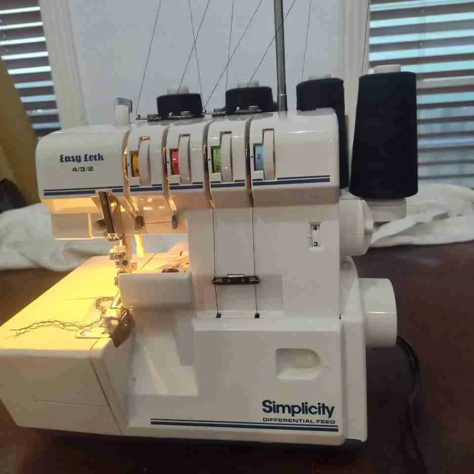 Complete serger machine setup with foot pedal assembly and full configuration in Houston TX